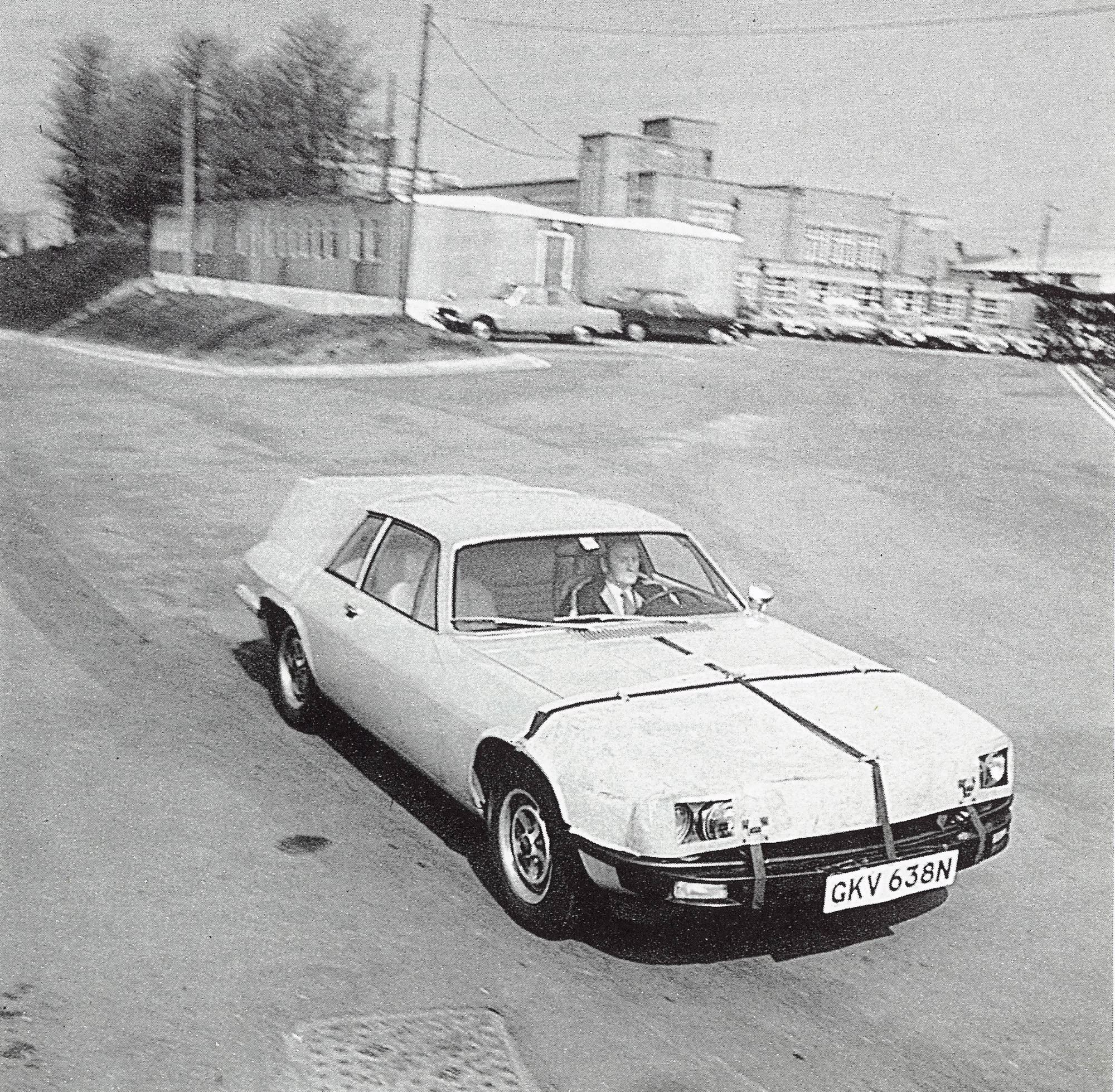 A rare Photo of an XJ27 with camouflage on it driven by Norman Dewis.